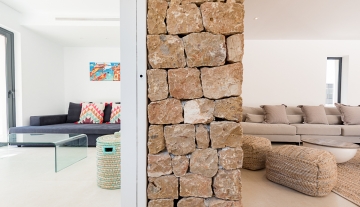 Resa estate modern villa for sale ibiza first line north stone room divider.jpg